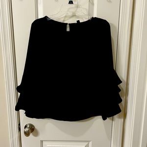 Black 3/4 sleeve top with bell sleeves.